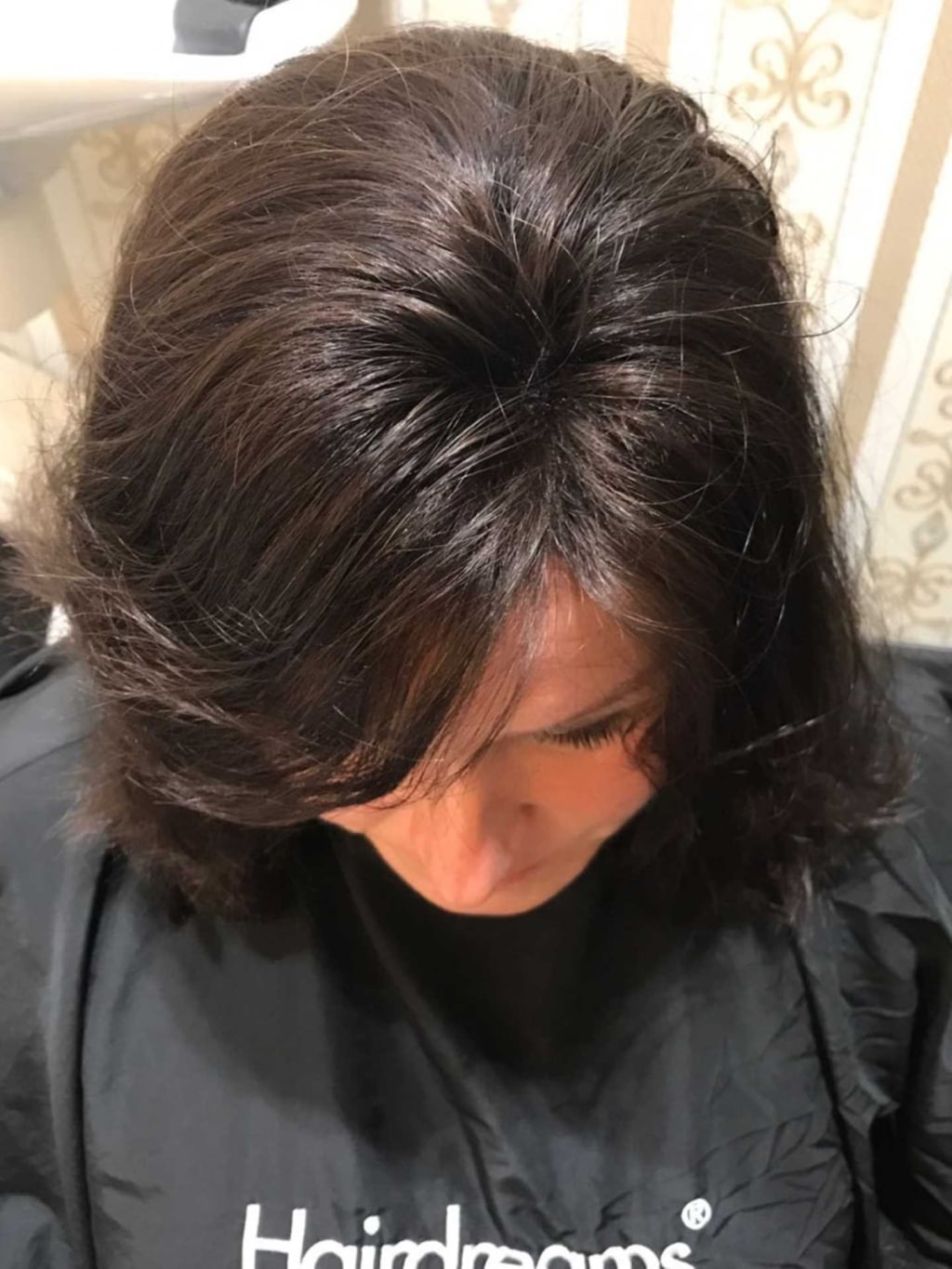 Woman with thick black hair and hair thickening with MicroLines by Hairdreams