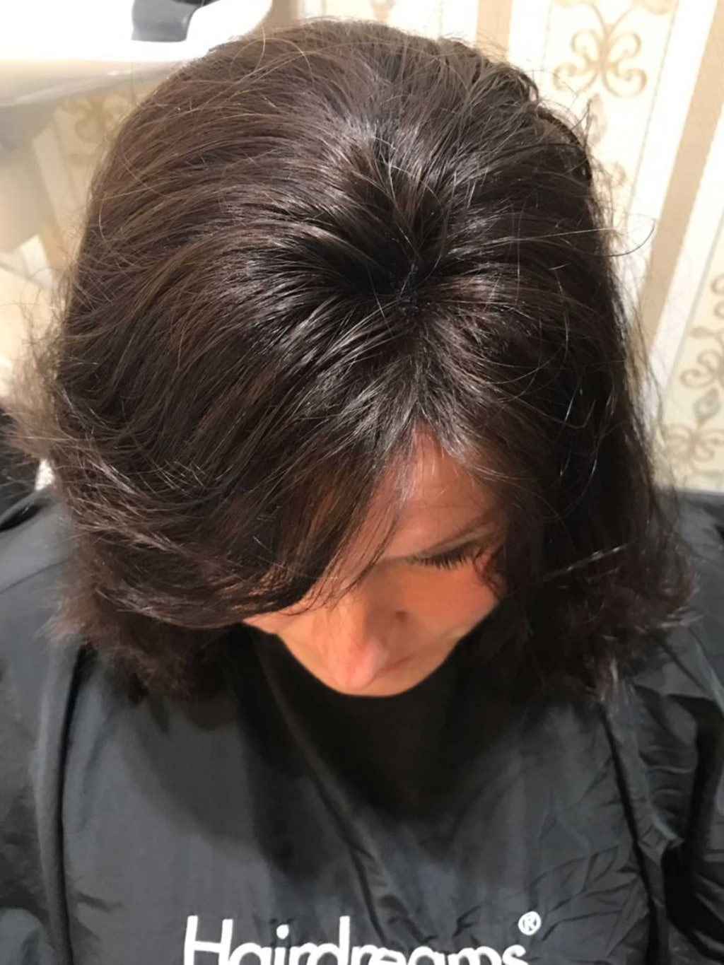 Woman with black hair after hair thickening with MicroLines by Hairdreams