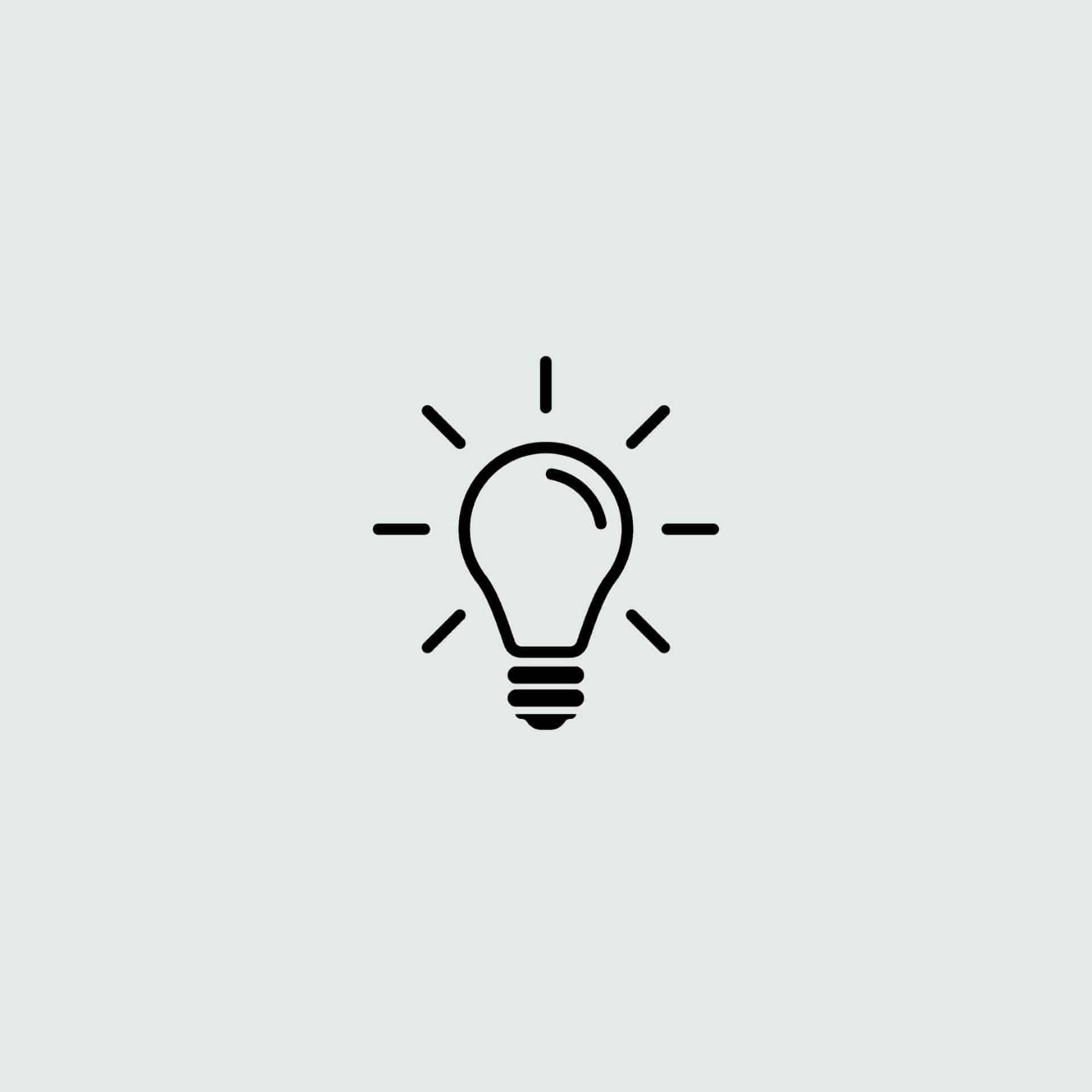 Graphic of a light bulb in black on a light background