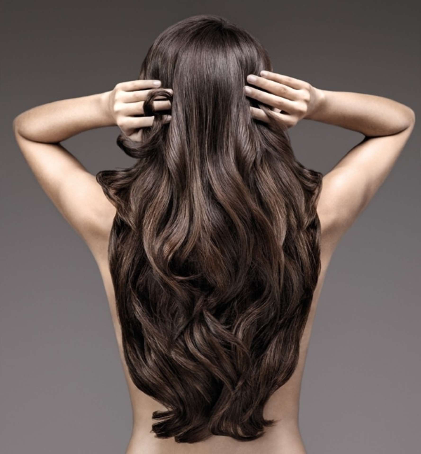 Woman from behind with long wavy dark hair