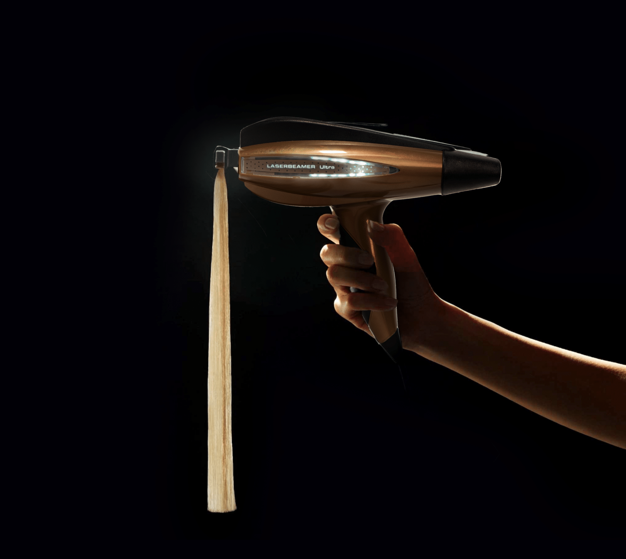 The Laserbeamer ULTRA device with a Hairdreams hair strand is presented on a dark-coloured background.